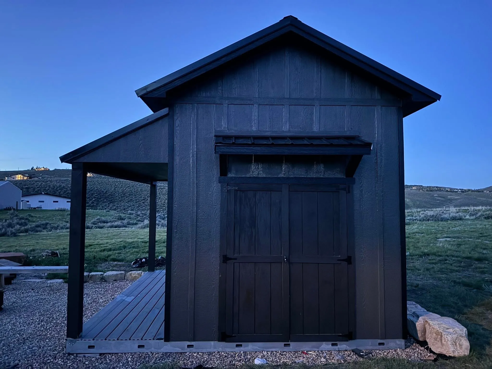 Black A-Frame gable shed with side porch built by ShedPro LLC Utah