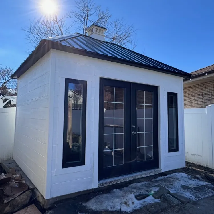 White pool house with black trim built by ShedPro LLC Utah