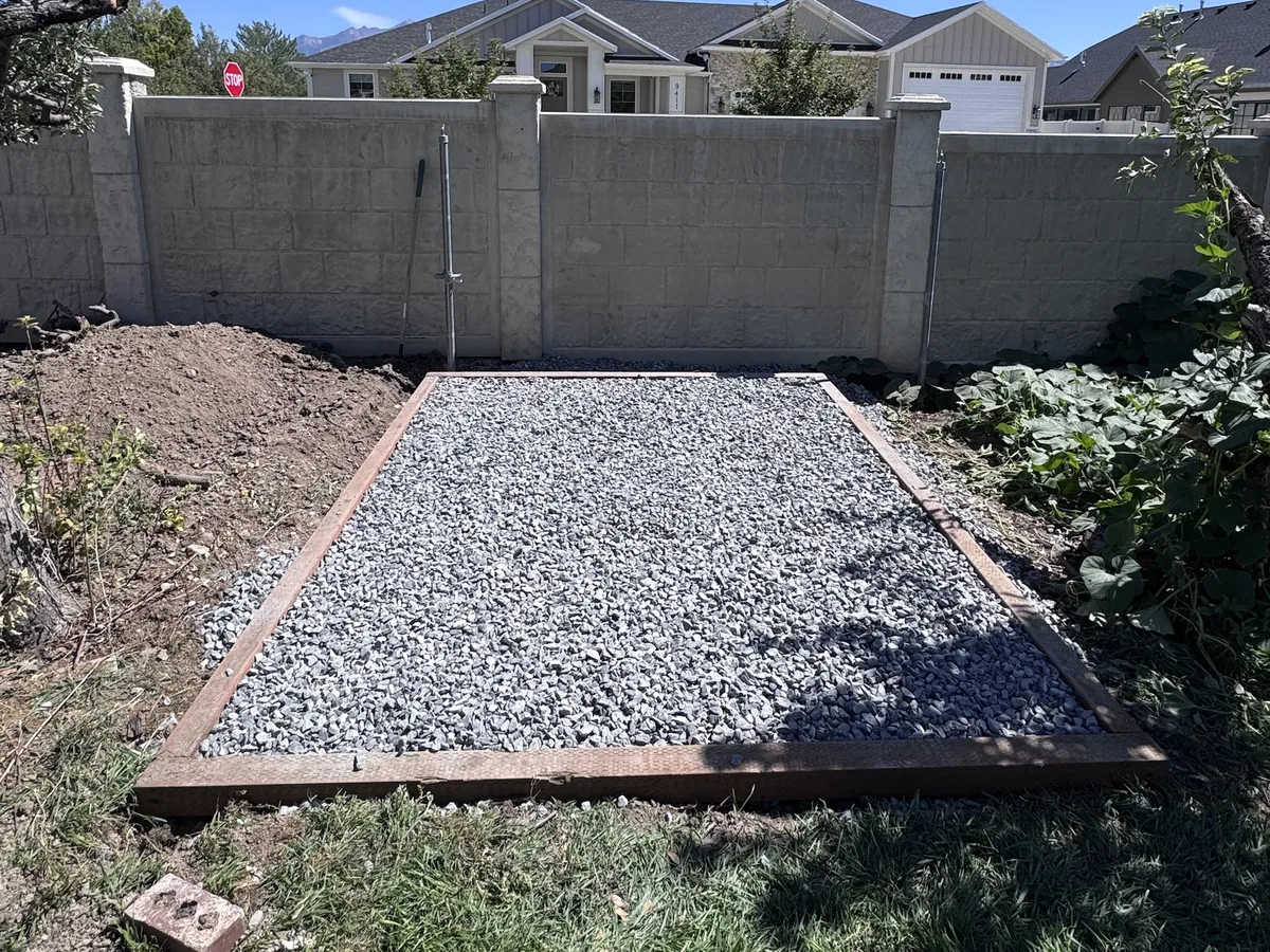 Crushed gravel shed pad boxed in with treated timber, built by ShedPro LLC in Utah