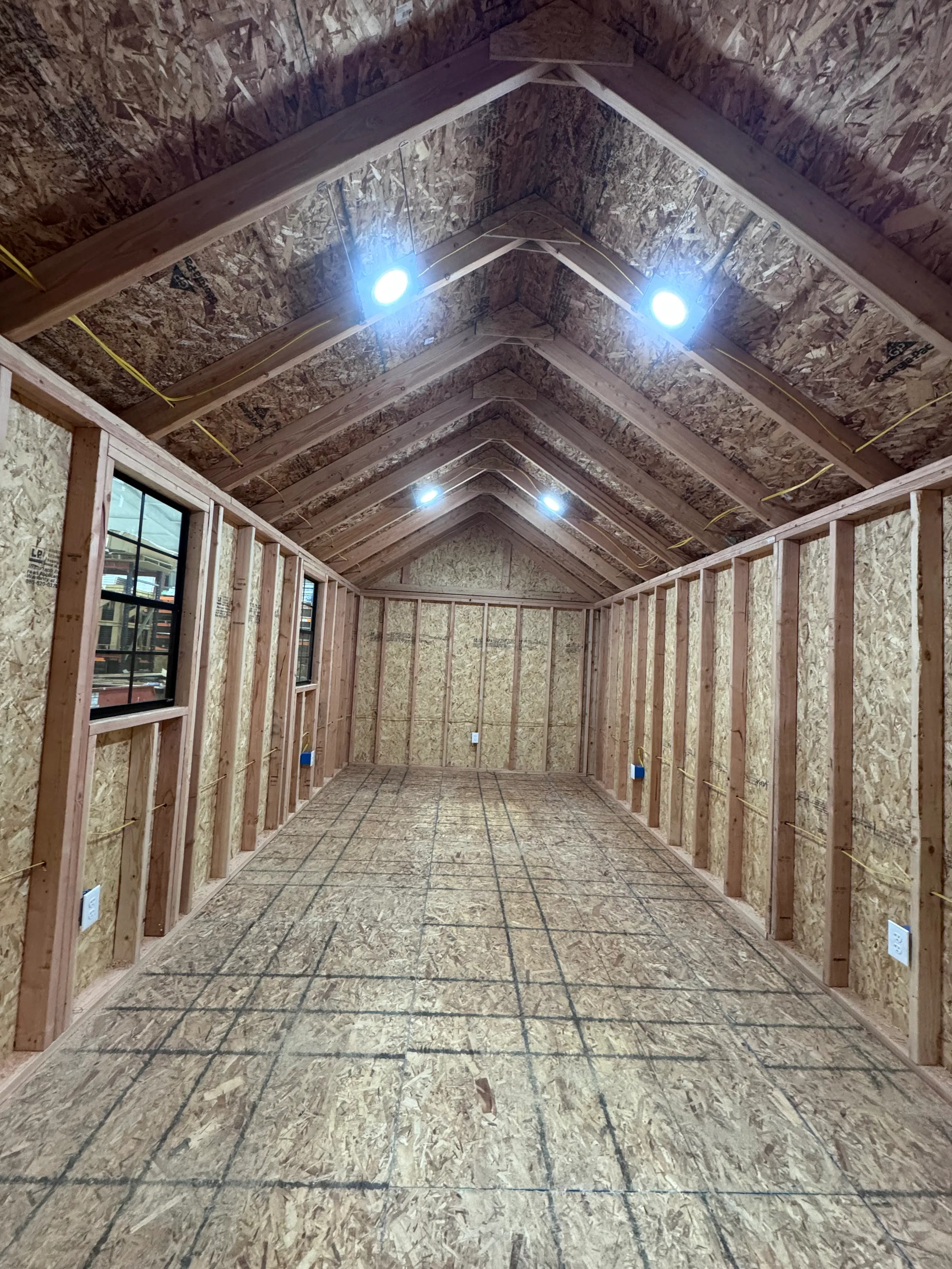 Shed interior with built-in lighting and electrical outlets
